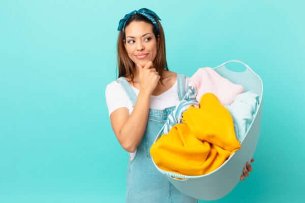 Image of woman considering a dry cleaning or laundry service