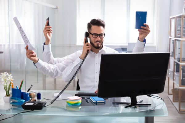 Busy Man Needing Many Hands To Get Everything Done